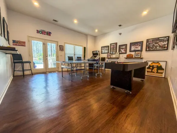 a living room with furniture window and wooden floor