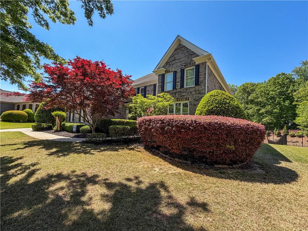 310 Flatstone Way Marietta, GA 30064 - Photo 3 of 44 a view of a house with a yard