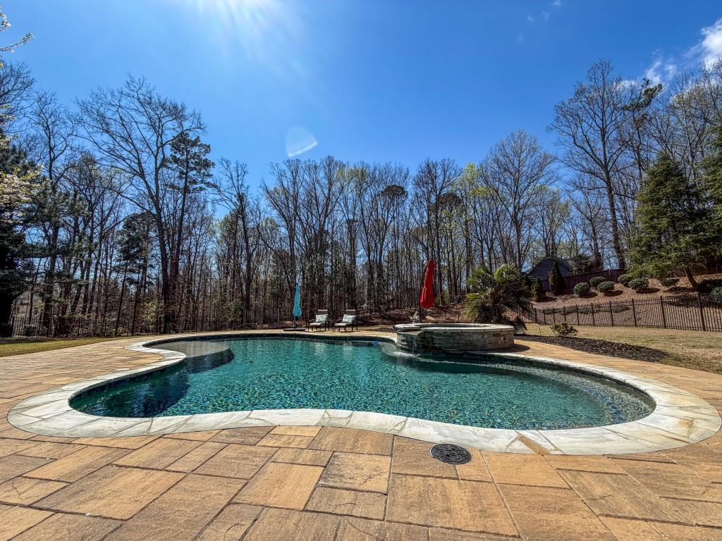 310 Flatstone Way Marietta, GA 30064 - Photo 39 of 44 a view of swimming pool with lawn chairs and plants
