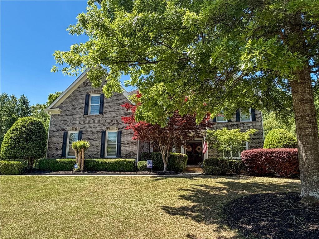 310 Flatstone Way Marietta, GA 30064 - Photo 4 of 44 a front view of a house with a garden