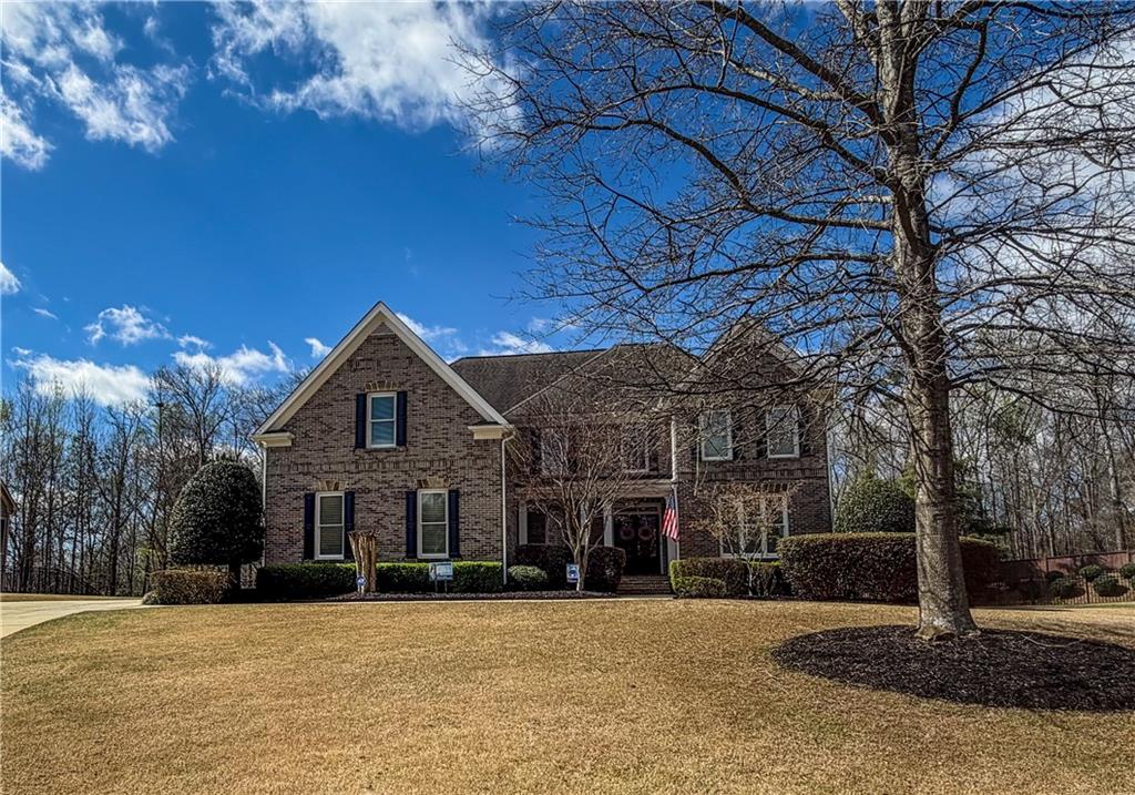 310 Flatstone Way Marietta, GA 30064 - Photo 5 of 44 a front view of a house with a yard