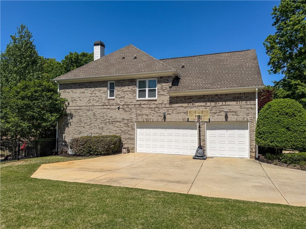 310 Flatstone Way Marietta, GA 30064 - Photo 8 of 44 a front view of a house with a yard