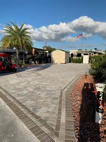 a view of multiple houses with a street