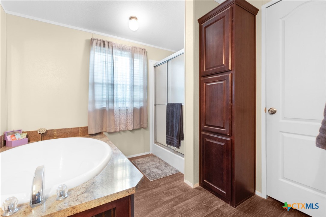 411 Private Road 3447 Kempner, TX 76539 - Photo 14 of 33 a spacious bathroom with a tub and shower