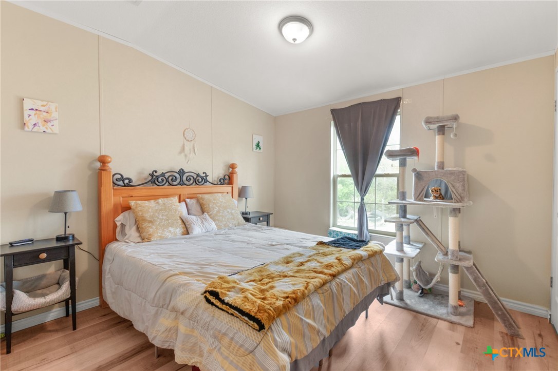 411 Private Road 3447 Kempner, TX 76539 - Photo 16 of 33 a bedroom with a bed and a window