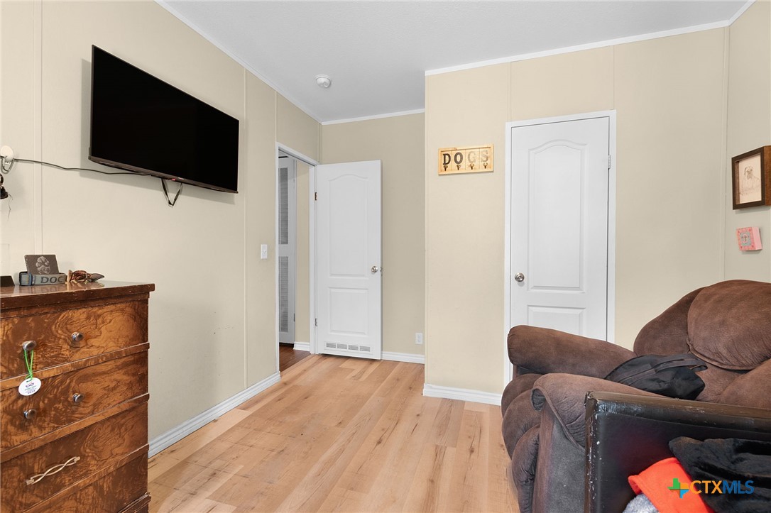 411 Private Road 3447 Kempner, TX 76539 - Photo 18 of 33 a bedroom with furniture and a flat screen tv