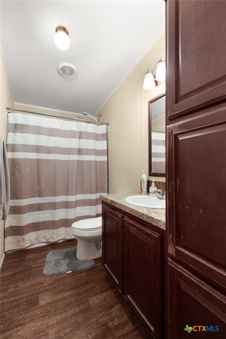 411 Private Road 3447 Kempner, TX 76539 - Photo 19 of 33 a bathroom with a sink a toilet and shower