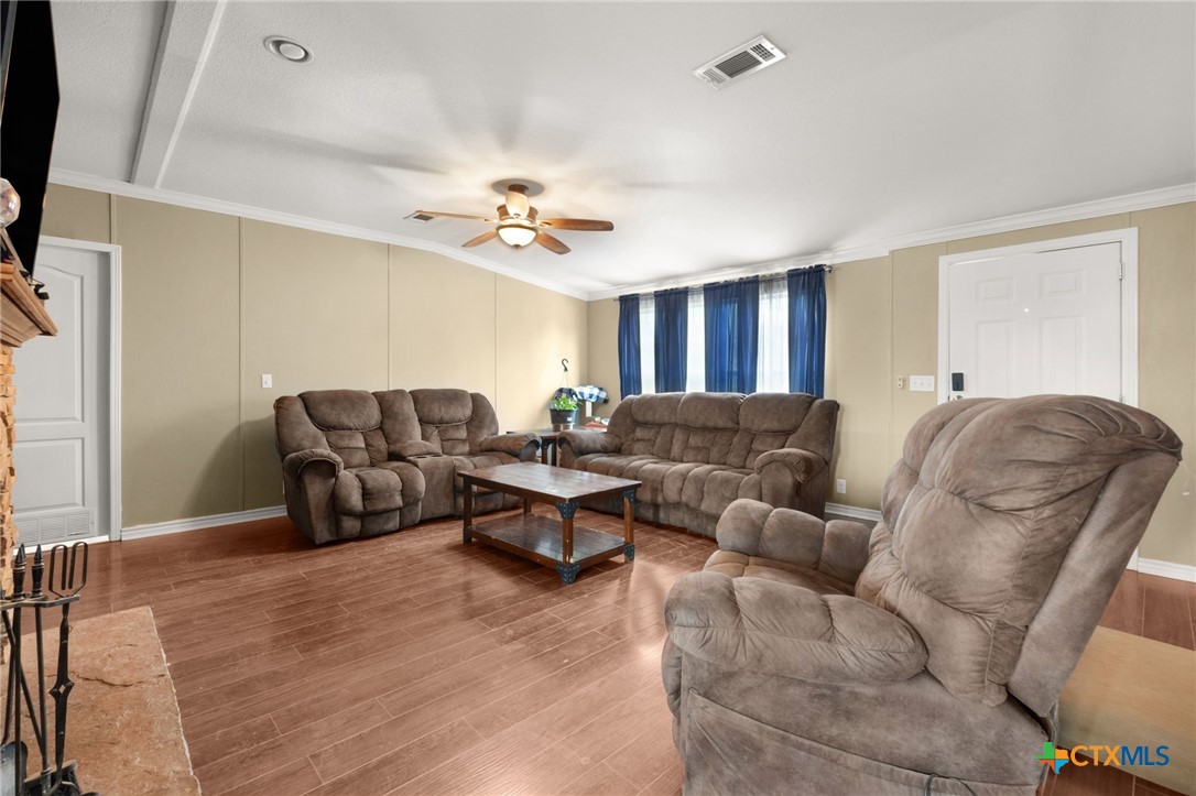 411 Private Road 3447 Kempner, TX 76539 - Photo 10 of 33 a living room with furniture and a ceiling fan