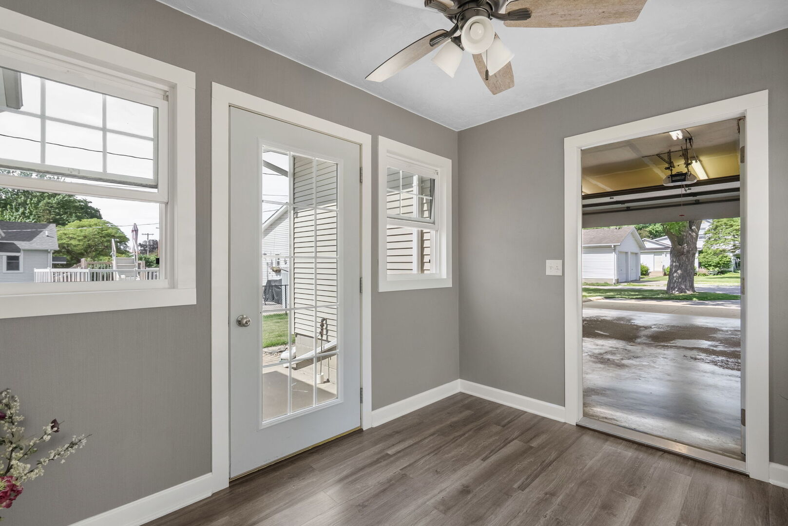417 North State Street Geneseo, IL 61254 - Photo 14 of 51 an empty room with wooden floor fan and windows