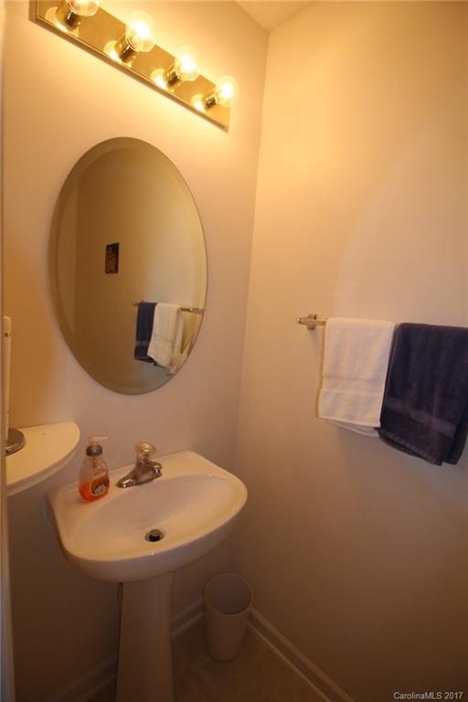 8272 Rudolph Road, Unit 8272 Charlotte, NC 28216 - Photo 15 of 17 a bathroom with a sink and mirror