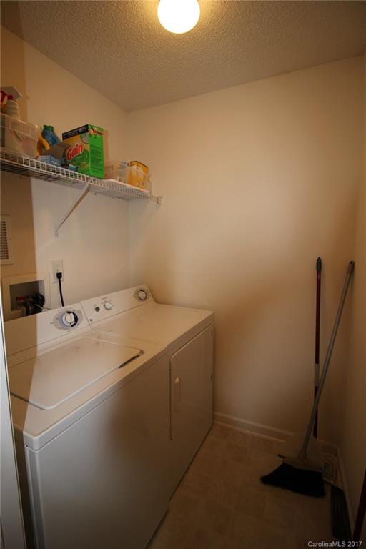 8272 Rudolph Road, Unit 8272 Charlotte, NC 28216 - Photo 16 of 17 a utility room with dryer and washer