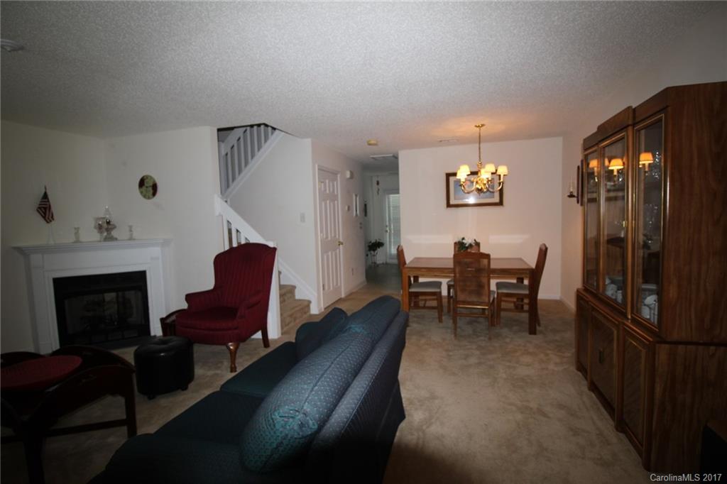 8272 Rudolph Road, Unit 8272 Charlotte, NC 28216 - Photo 6 of 17 a view of a livingroom with furniture and a fireplace