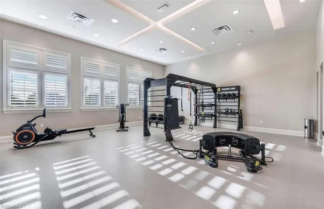 a room with furniture and gym equipment