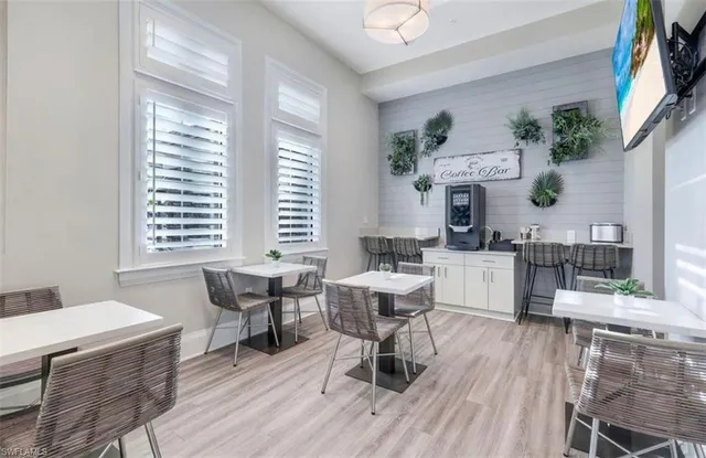 a view of a dining room with furniture window and wooden floor