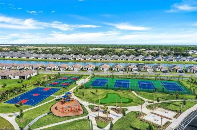 a living room with furniture a flat screen tv and gym equipment