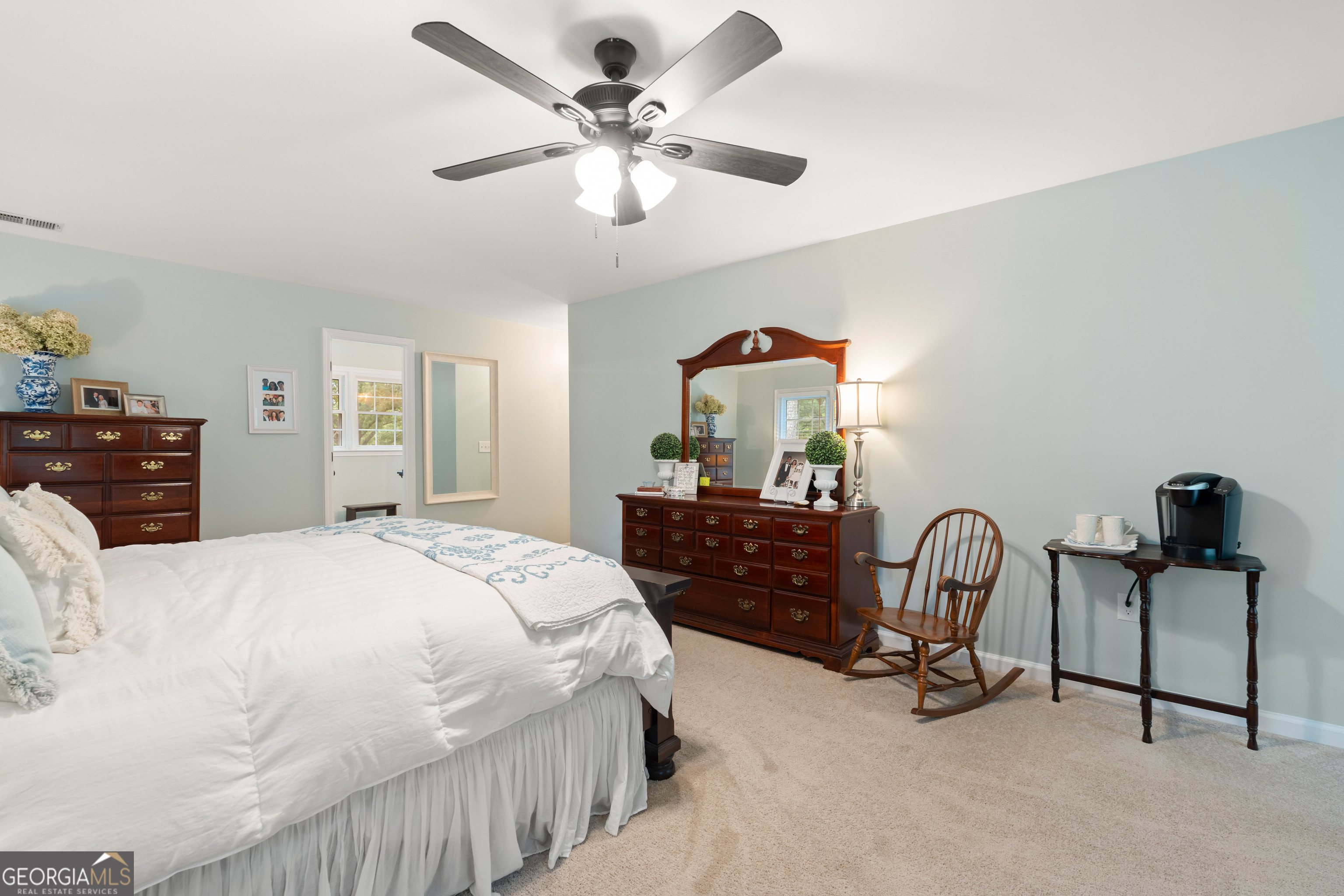 836 Oak Grove Road Carrollton, GA 30117 - Photo 31 of 50 a bedroom with a bed and a chandelier