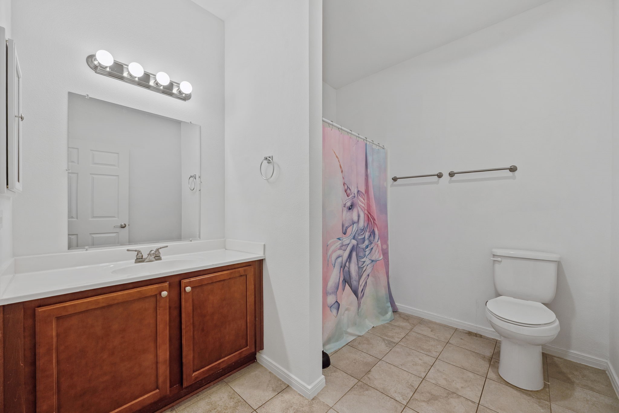 325 Cemetery Road Coldspring, TX 77331 - Photo 20 of 31 a spacious bathroom with a toilet sink and shower
