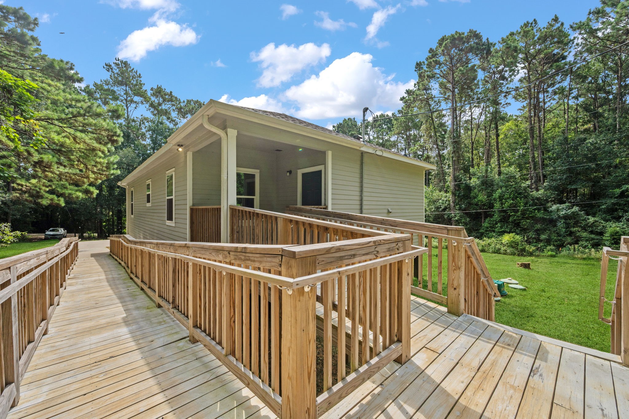 325 Cemetery Road Coldspring, TX 77331 - Photo 24 of 31 a view of a house with a deck