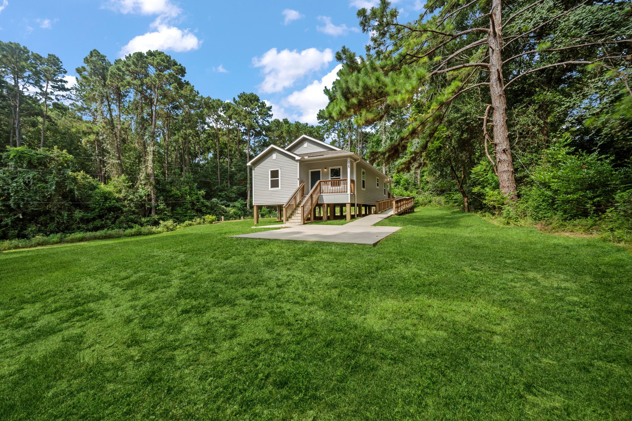 325 Cemetery Road Coldspring, TX 77331 - Photo 30 of 31 a view of a small garden with a small house