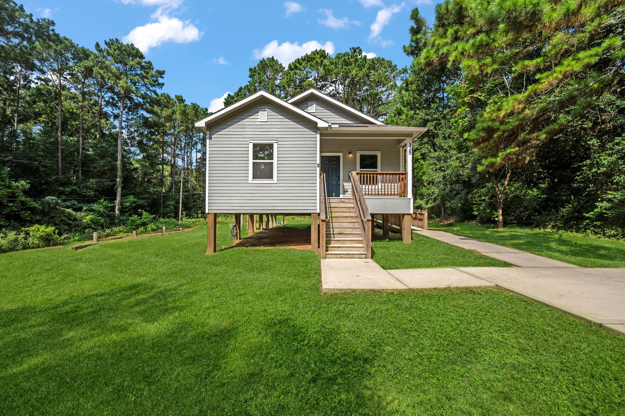 325 Cemetery Road Coldspring, TX 77331 - Photo 3 of 31 a view of a house with backyard and garden