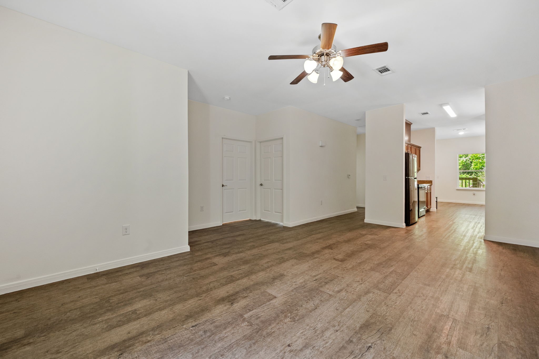 325 Cemetery Road Coldspring, TX 77331 - Photo 5 of 31 a view of an empty room with wooden floor