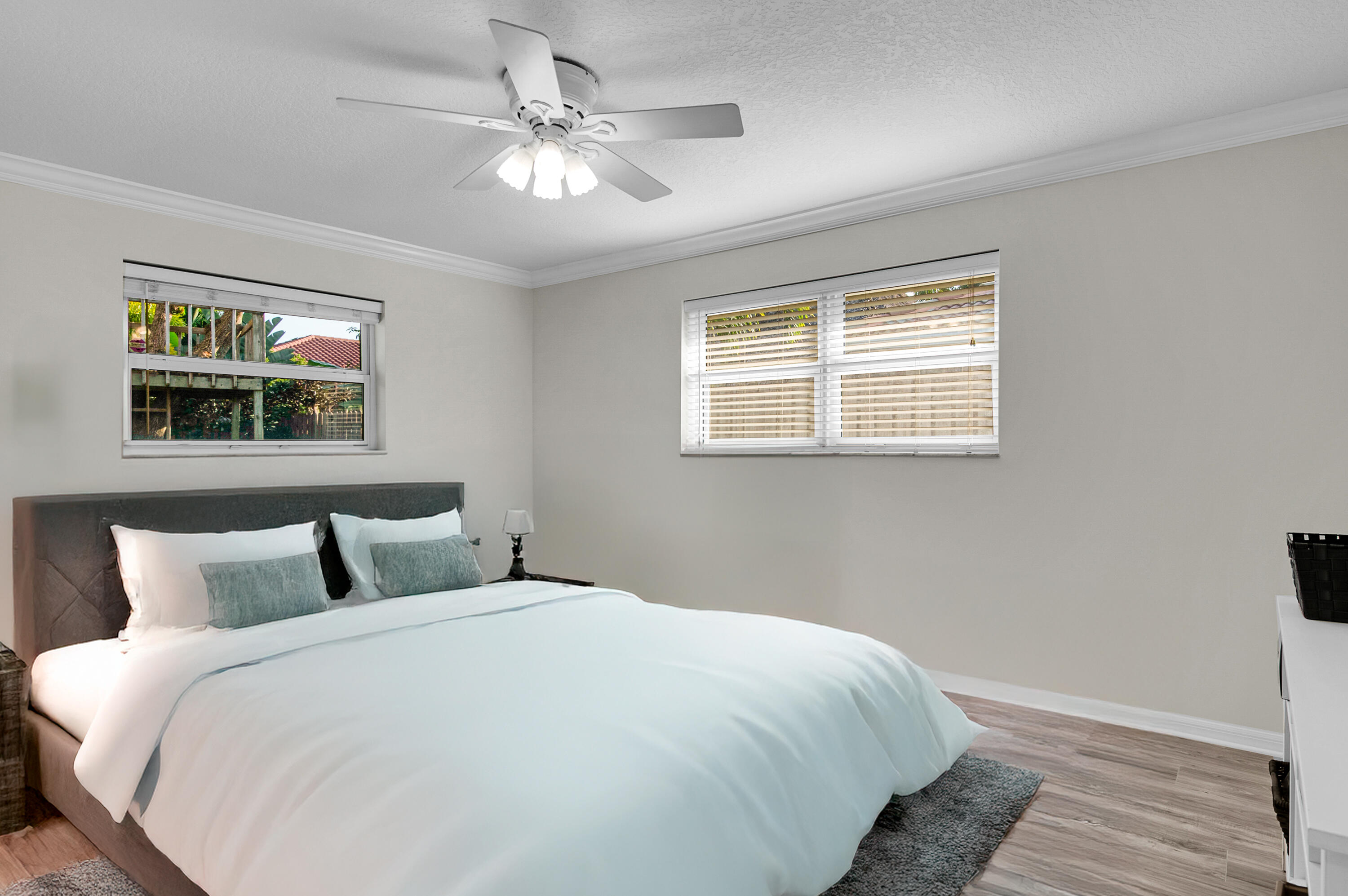 1560 Southwest 16th Street Boca Raton, FL 33486 - Photo 23 of 72 a bedroom with a large bed and a window