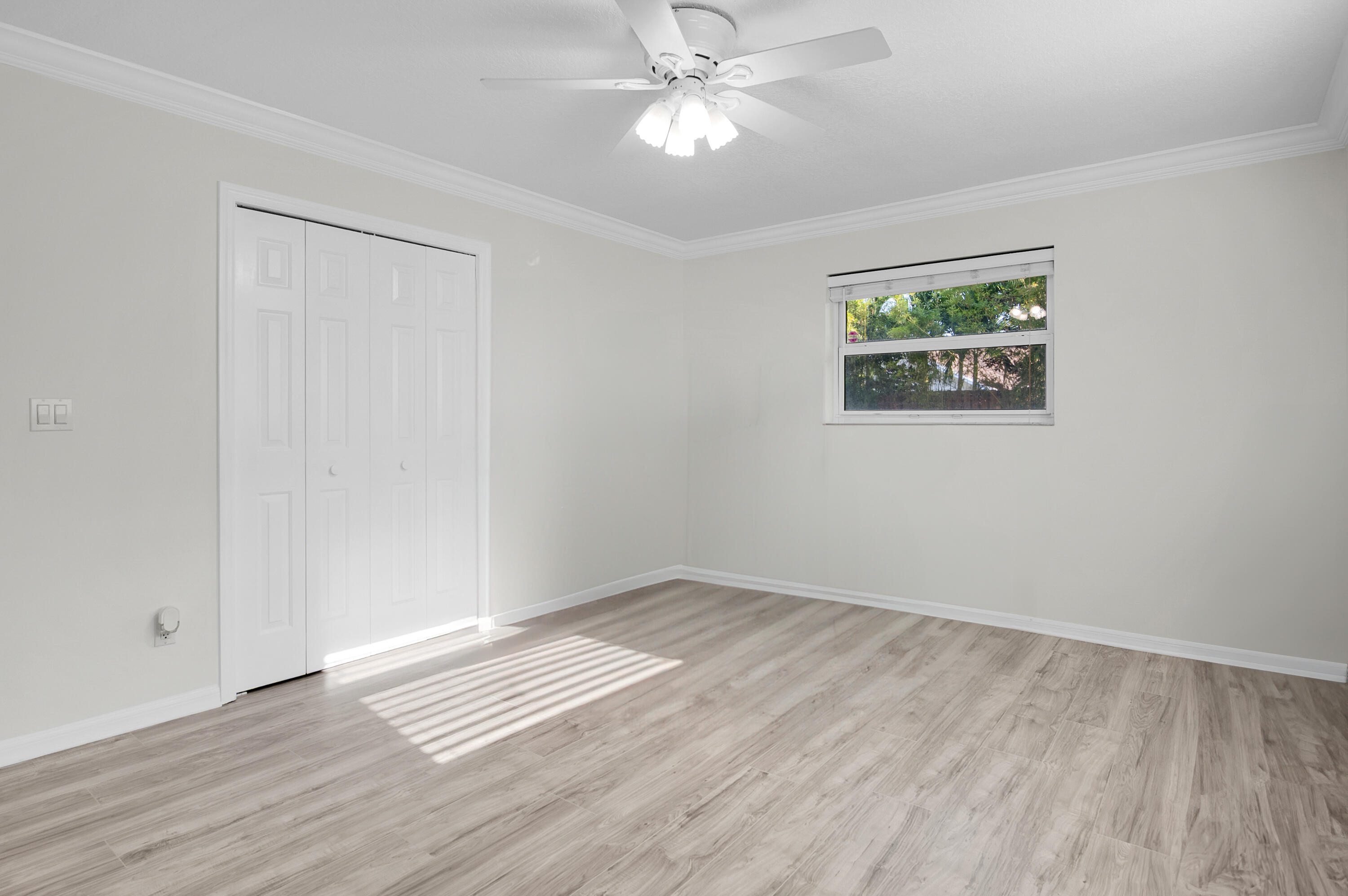1560 Southwest 16th Street Boca Raton, FL 33486 - Photo 24 of 72 wooden floor in an empty room with a window