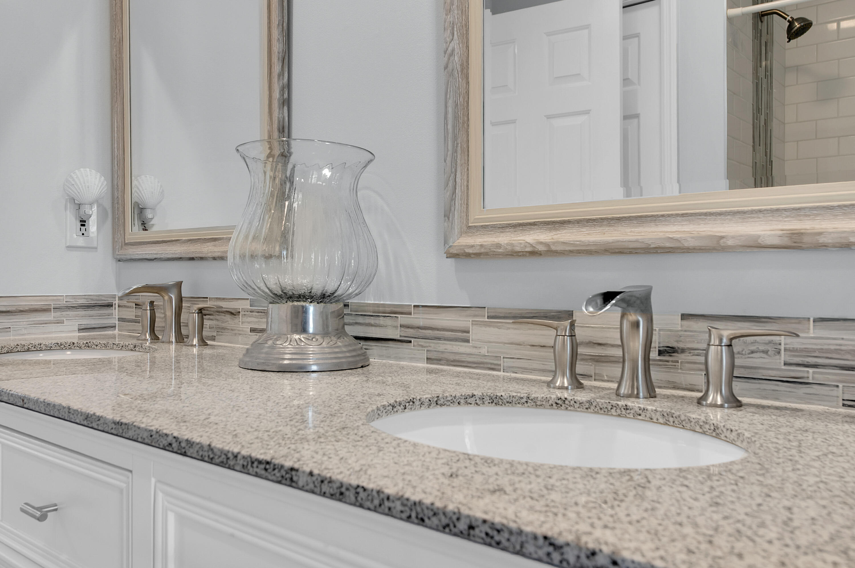 1560 Southwest 16th Street Boca Raton, FL 33486 - Photo 30 of 72 a bathroom with sink and mirror