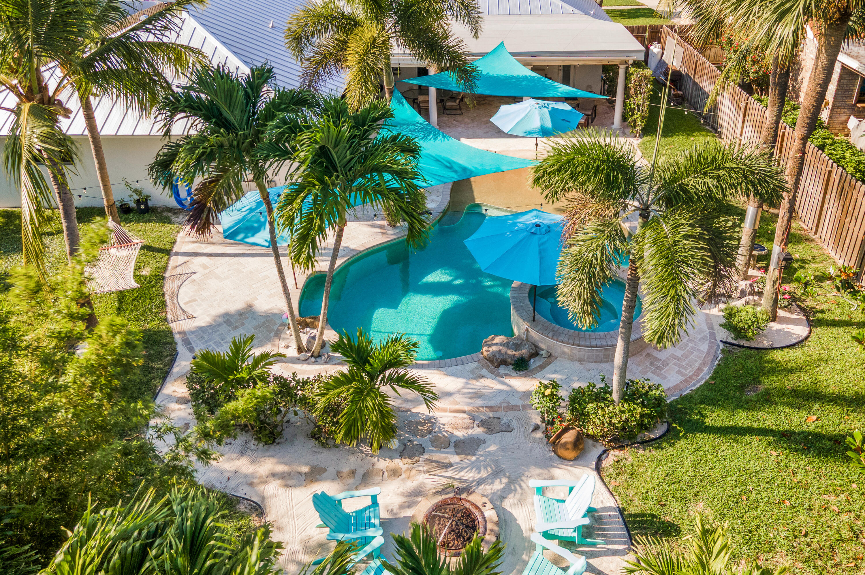 1560 Southwest 16th Street Boca Raton, FL 33486 - Photo 3 of 72 an aerial view of a house with a yard and garden