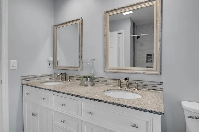 a kitchen with stainless steel appliances granite countertop a stove and a sink