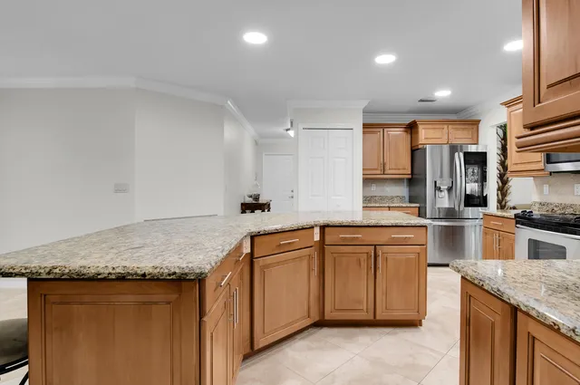 a view of a backyard with plants and chair