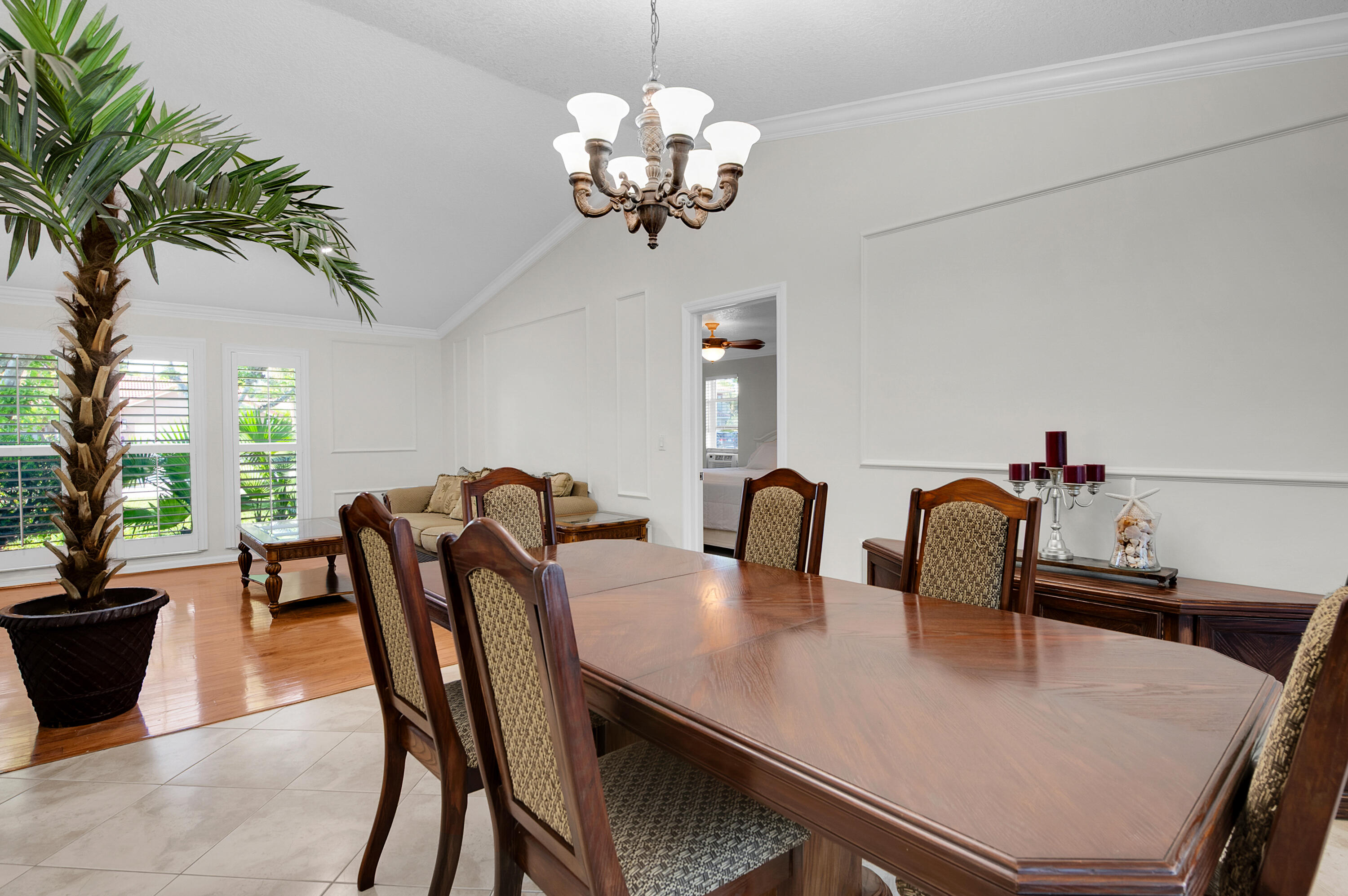1560 Southwest 16th Street Boca Raton, FL 33486 - Photo 45 of 72 a view of a dining room with furniture and chandelier