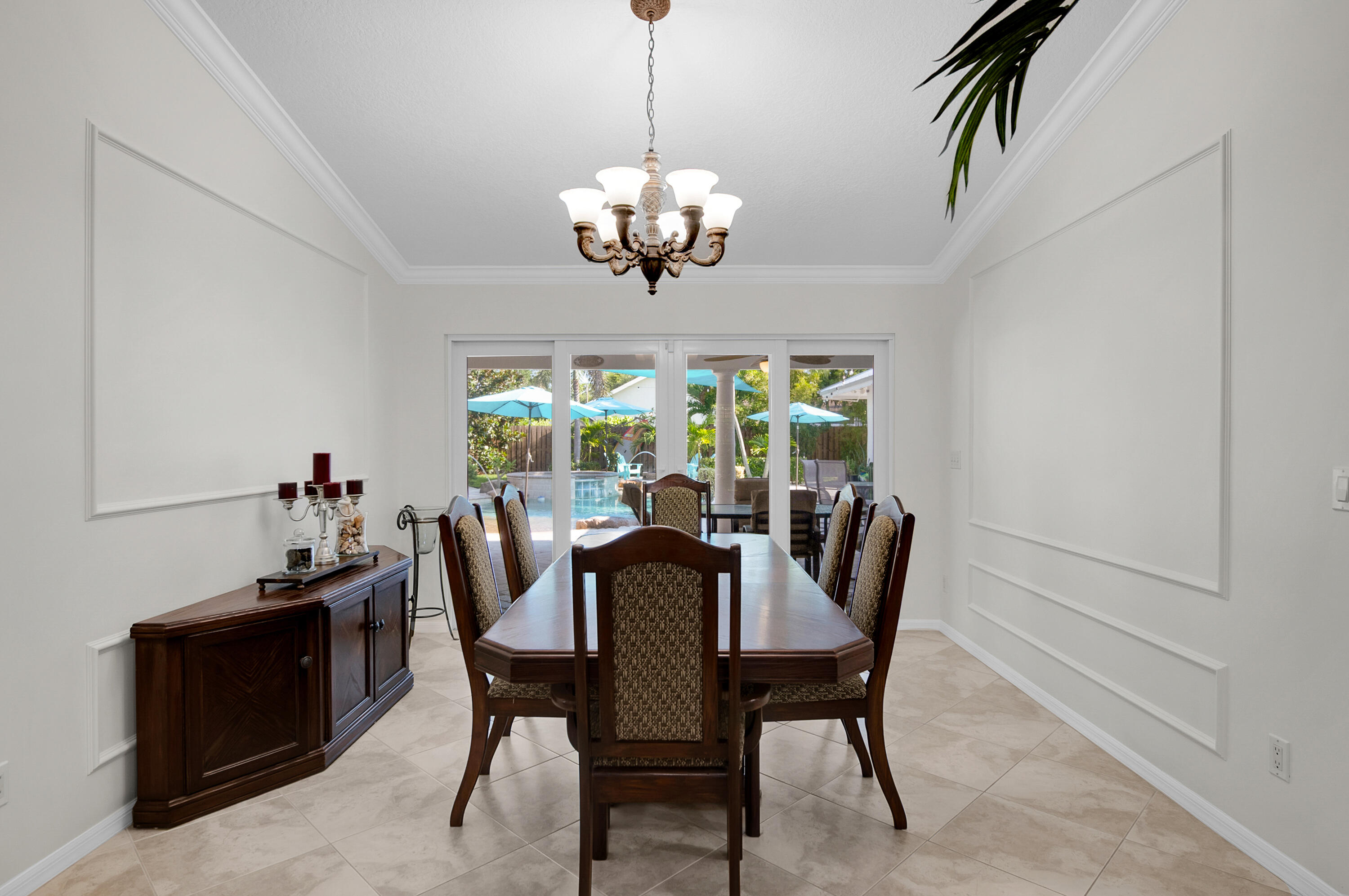 1560 Southwest 16th Street Boca Raton, FL 33486 - Photo 48 of 72 a view of a dining room with furniture a chandelier and window