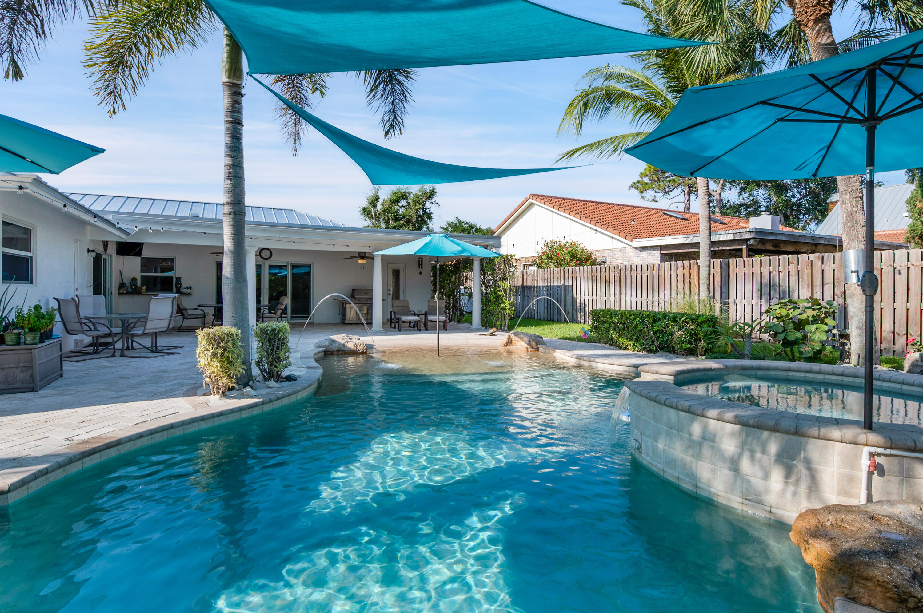 1560 Southwest 16th Street Boca Raton, FL 33486 - Photo 60 of 72 a view of a swimming pool with a patio