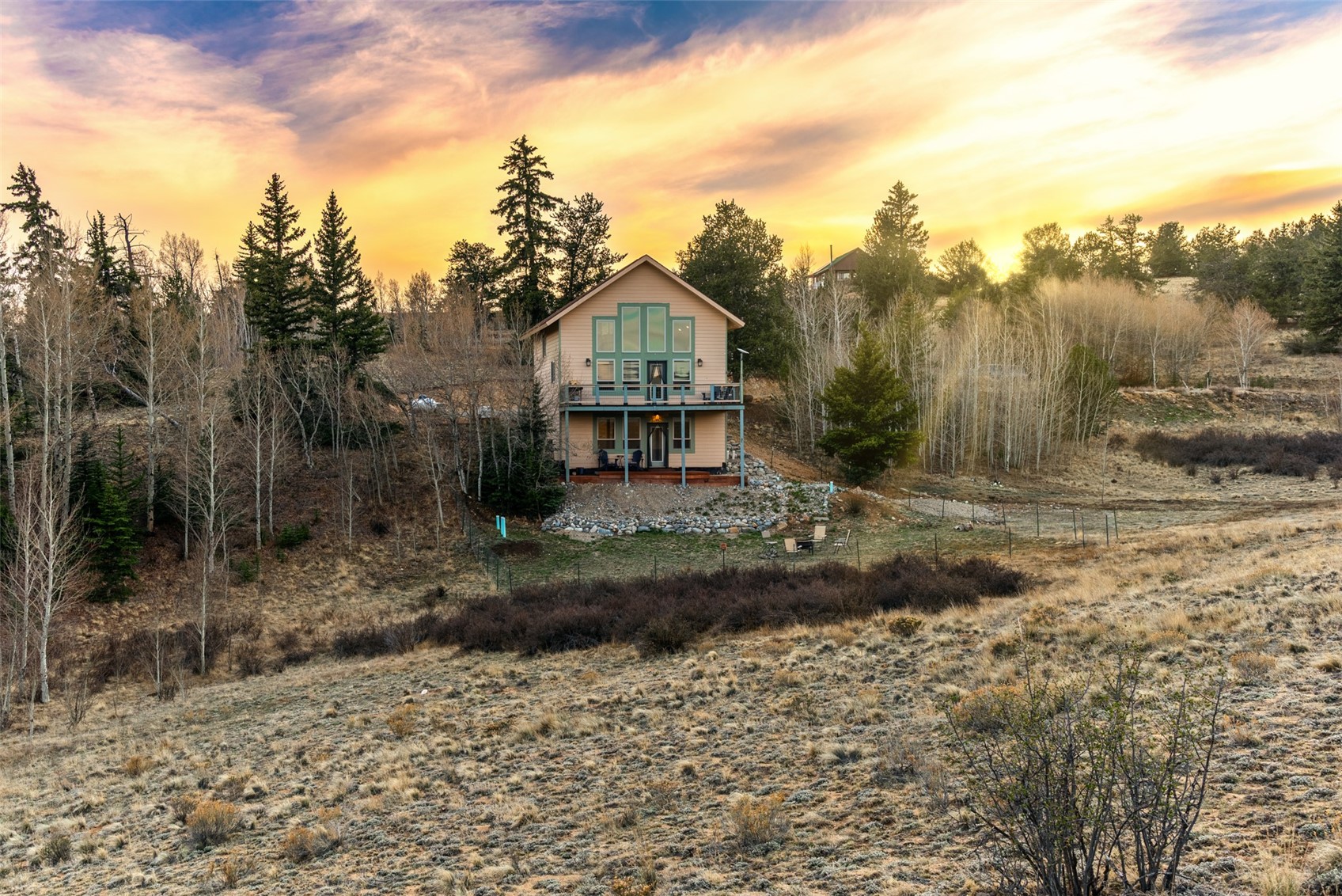 440 Arland Road Como, CO 80432 - Photo 1 of 49 a front view of a house with a yard