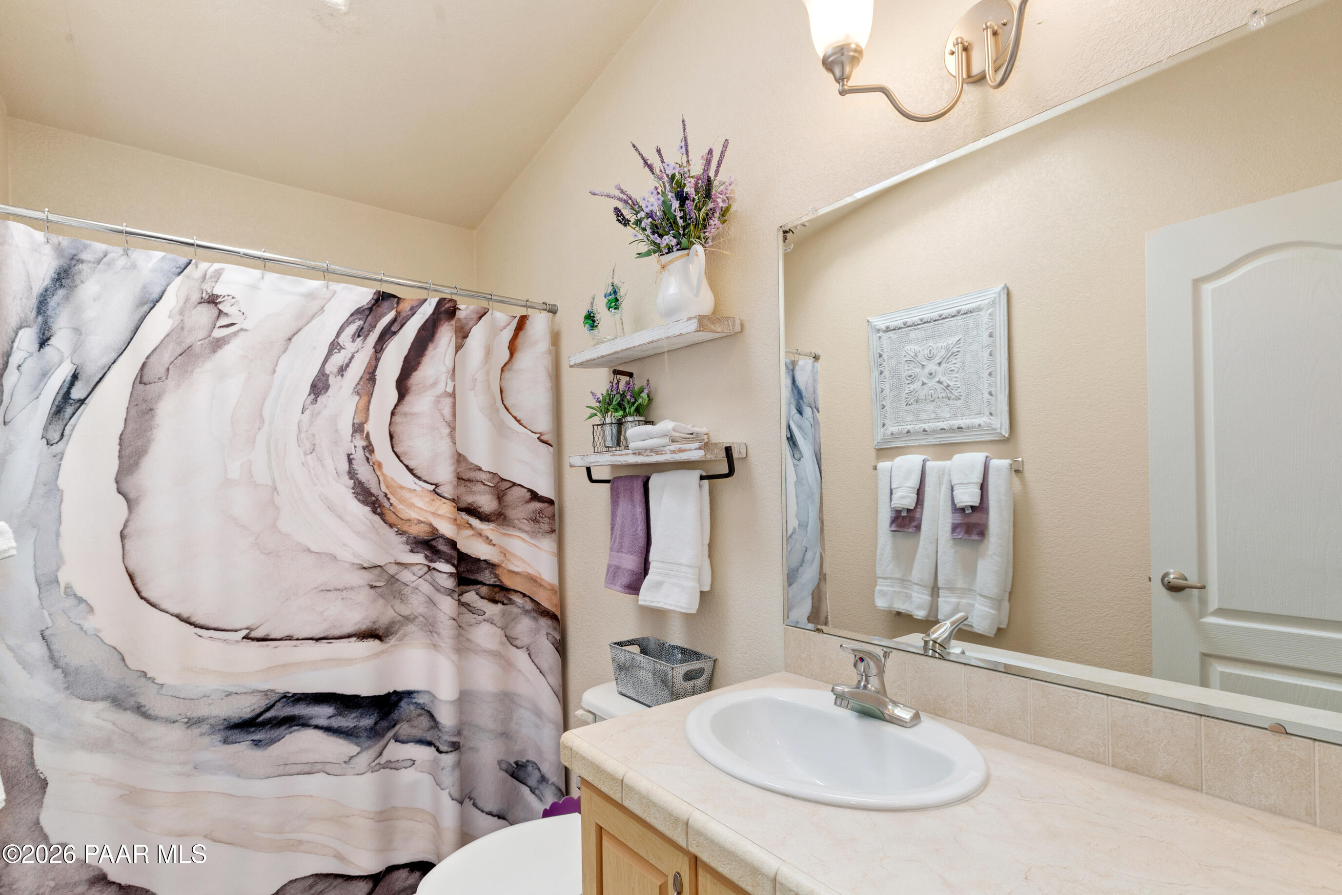 11250 East State Rte 69 Dewey, AZ 86327 - Photo 23 of 38 a bathroom with a sink mirror and vanity