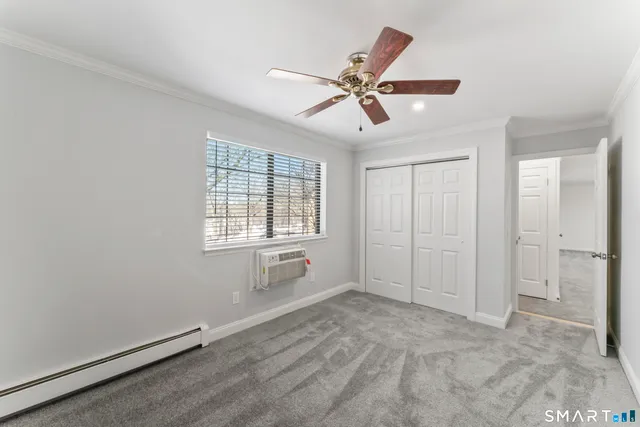 a view of a hallway with wooden shelves