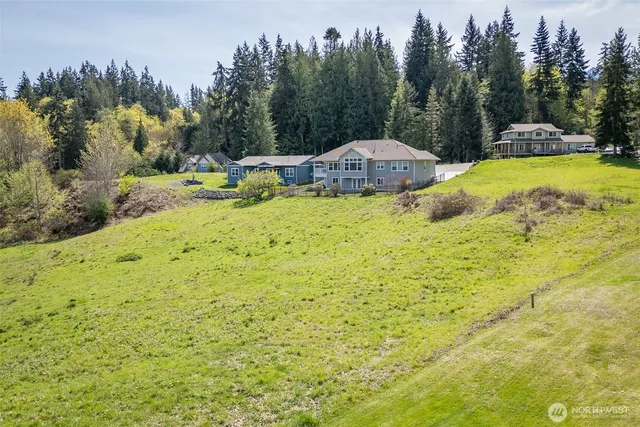 a view of a swimming pool with an outdoor space and seating area