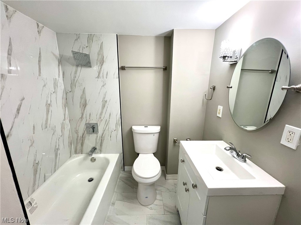 3527 Broadview Road Cleveland, OH 44109 - Photo 15 of 29 Full bathroom featuring tile floors, vanity, tiled shower / bath combo, and toilet