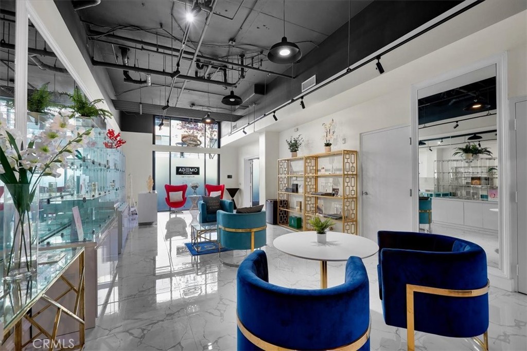 300 East 4th Street, Unit 103 Long Beach, CA 90802 - Photo 18 of 75 a living room with furniture and a flat screen tv