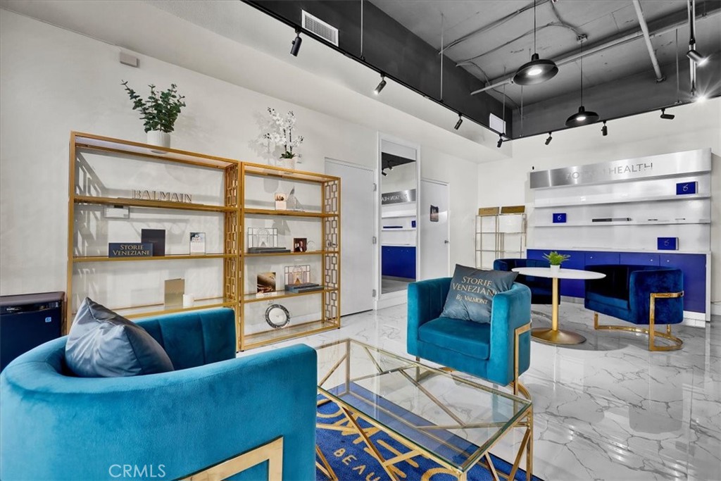 300 East 4th Street, Unit 103 Long Beach, CA 90802 - Photo 27 of 75 a living room with furniture and a floor to ceiling window