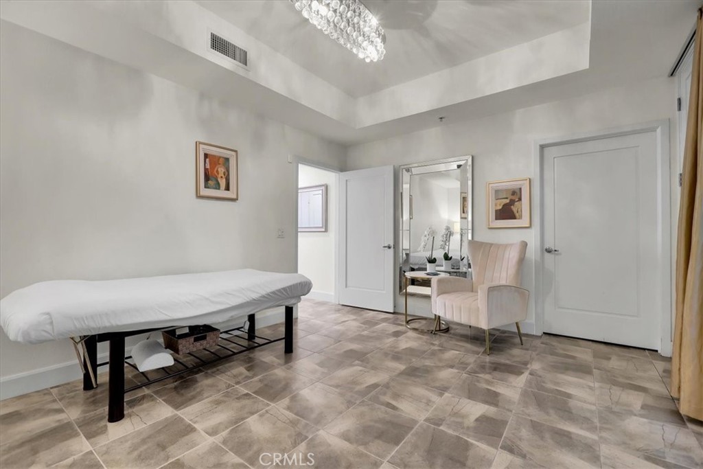 300 East 4th Street, Unit 103 Long Beach, CA 90802 - Photo 48 of 75 a view of a livingroom with furniture and a chandelier