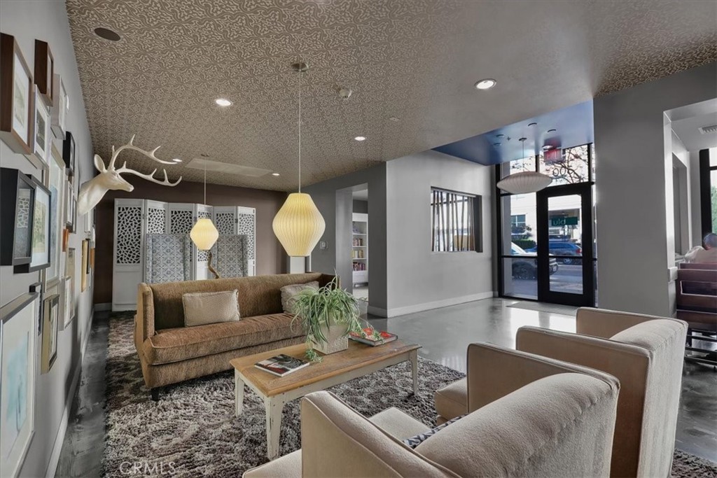 300 East 4th Street, Unit 103 Long Beach, CA 90802 - Photo 59 of 75 a living room with furniture and wooden floor