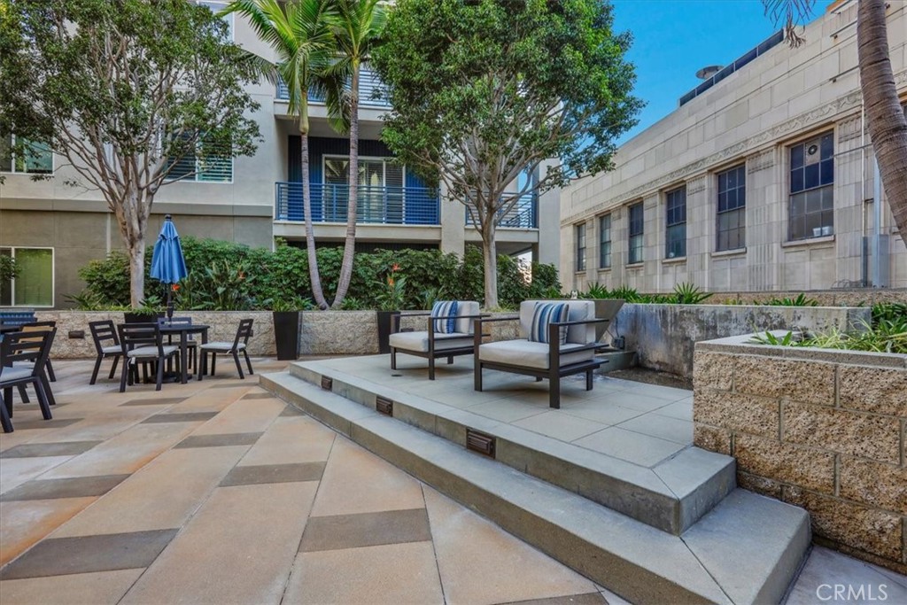 300 East 4th Street, Unit 103 Long Beach, CA 90802 - Photo 65 of 75 a view of a patio with couches table and chairs and potted plants