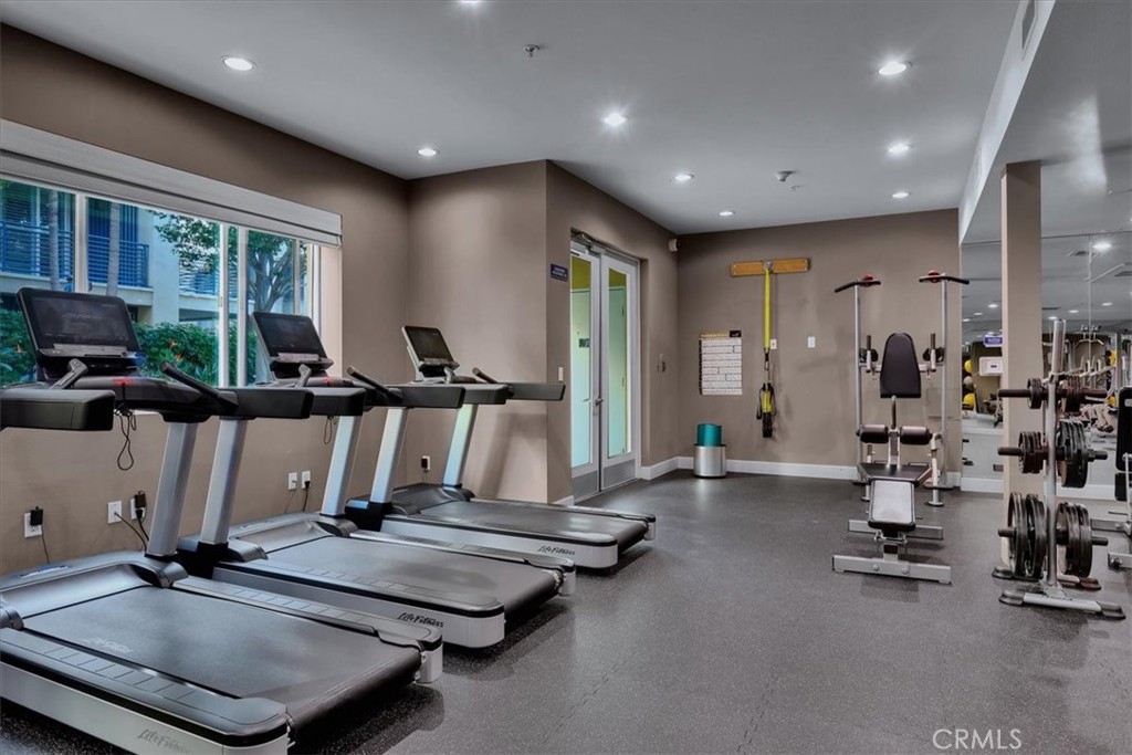 300 East 4th Street, Unit 103 Long Beach, CA 90802 - Photo 75 of 75 a room with gym equipment and a large window