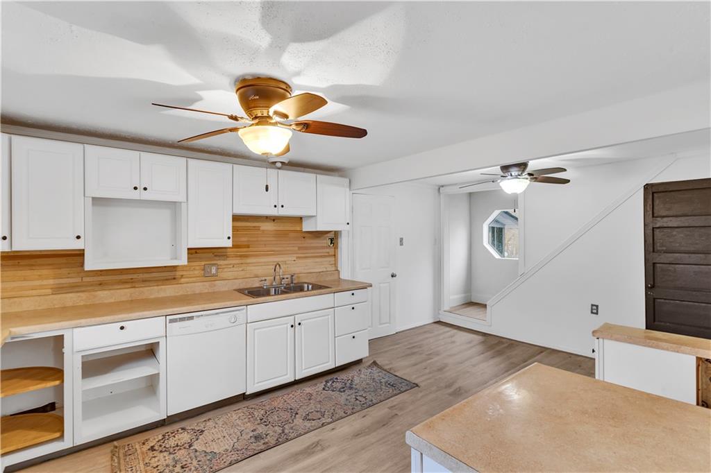 531 5th Avenue Avonmore, PA 15618 - Photo 12 of 25 a kitchen with stainless steel appliances granite countertop a sink a stove and refrigerator