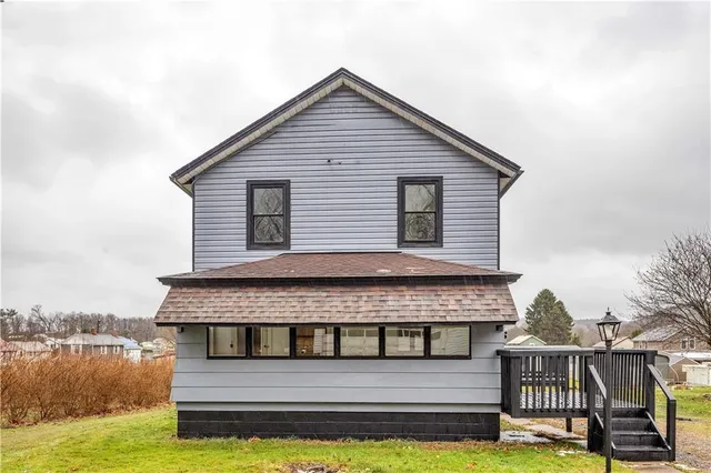 a house view with a sitting space and garden space