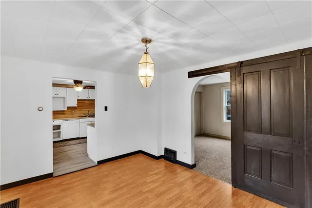 wooden floor in an empty room and a window