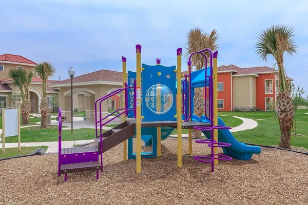 a childrens park with lots of swings and slides