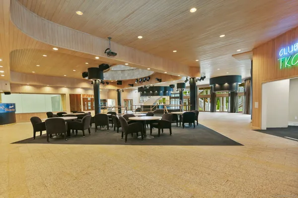 a view of a lobby with black carpet